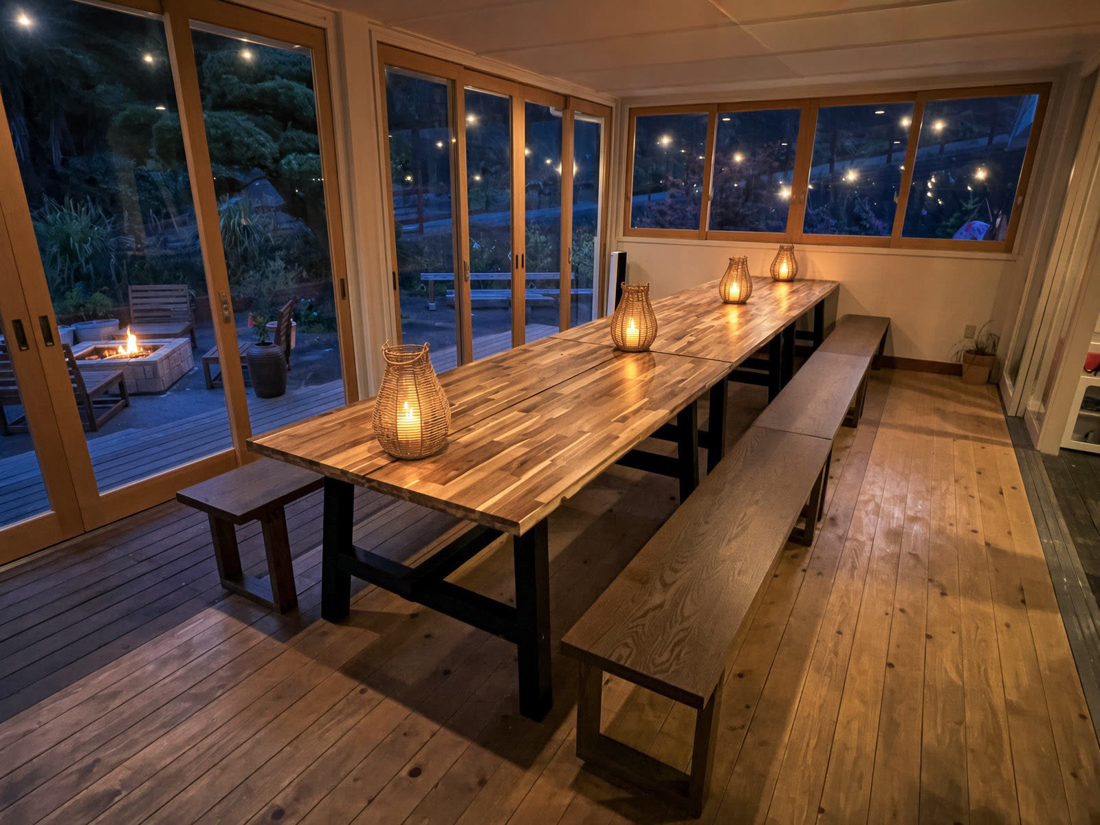 The table at night, lanterns, fire outside